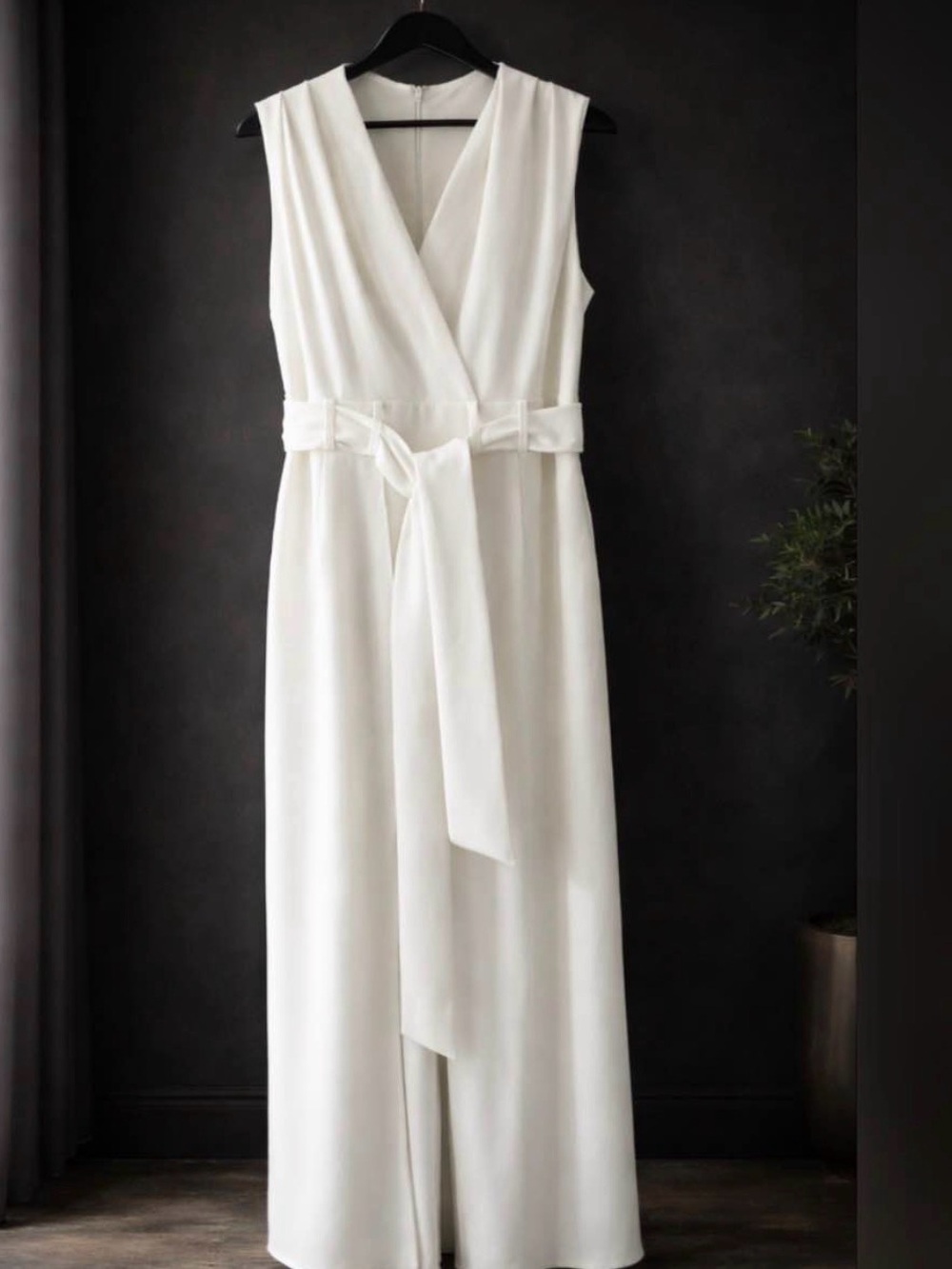 Shelby & Palmer White Sleeveless Surplice Jumpsuit with Waist Tie